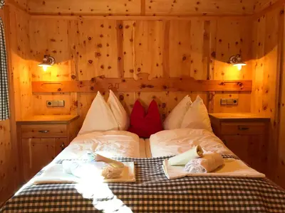 Ein Bett oder Betten in einem Zimmer der Unterkunft Urige Kuschelhütten Oberprenner