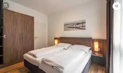 Ein Bett oder Betten in einem Zimmer der Unterkunft Stadtdomizil TOP 10