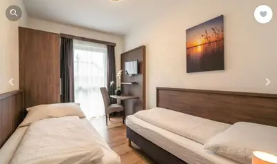 Ein Bett oder Betten in einem Zimmer der Unterkunft Stadtdomizil TOP 10