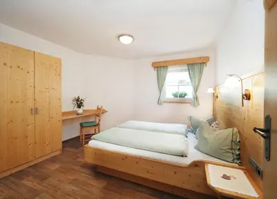 Ein Bett oder Betten in einem Zimmer der Unterkunft Lürzergut