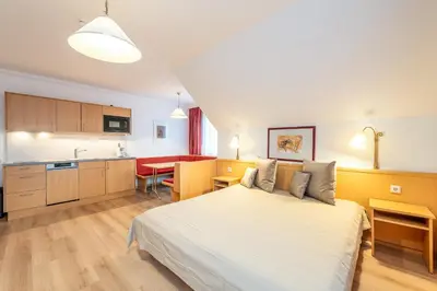 Ein Bett oder Betten in einem Zimmer der Unterkunft Reisslerhof Hotel & Apartments - by myNests