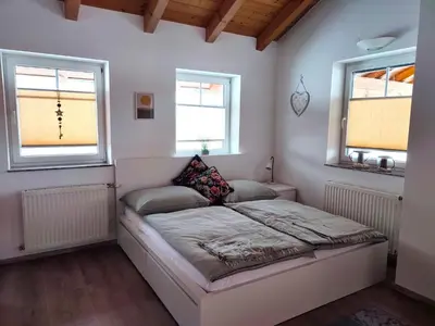 Ein Bett oder Betten in einem Zimmer der Unterkunft Ferienwohnung Schörghofer