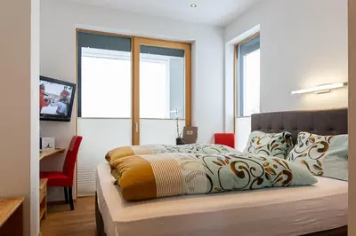 Ein Bett oder Betten in einem Zimmer der Unterkunft Hotel Das Hochkönig
