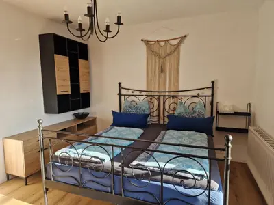 Ein Bett oder Betten in einem Zimmer der Unterkunft Family House Bad Goisern am Hallstättersee