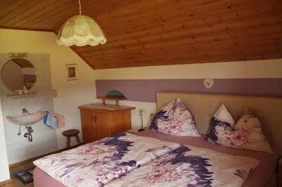 Ein Bett oder Betten in einem Zimmer der Unterkunft Lassacher Biobauernhof