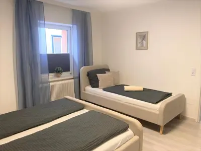Ein Bett oder Betten in einem Zimmer der Unterkunft Ferienwohnung im Zentrum mit Parkplatz