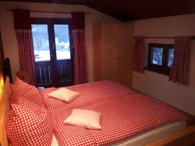 Ein Bett oder Betten in einem Zimmer der Unterkunft Almhaus Grubhof