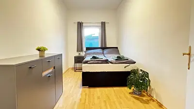 Ein Bett oder Betten in einem Zimmer der Unterkunft Almtal Apartments