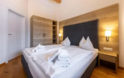 Ein Bett oder Betten in einem Zimmer der Unterkunft Appartementhaus Falke und Adler