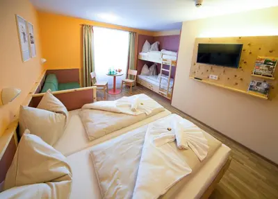 Ein Bett oder Betten in einem Zimmer der Unterkunft JUFA Hotel Planneralm