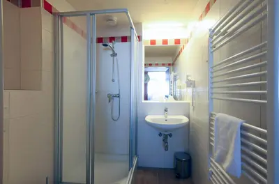 Ein Badezimmer in der Unterkunft JUFA Hotel Planneralm