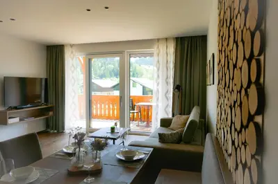 Ein Sitzbereich in der Unterkunft Apartment Grimmingpanorama