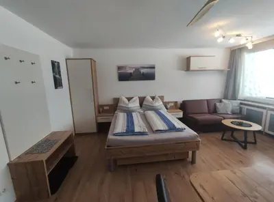 Ein Bett oder Betten in einem Zimmer der Unterkunft Wolfgangseeblick - Ferienwohnung Vockner