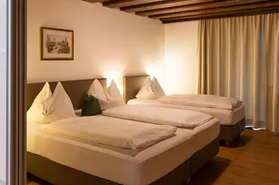 Ein Bett oder Betten in einem Zimmer der Unterkunft Gästehaus Anneliese
