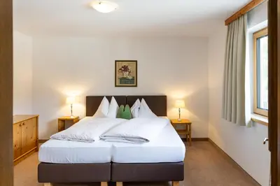 Ein Bett oder Betten in einem Zimmer der Unterkunft Gästehaus Anneliese