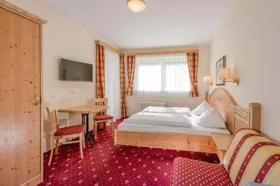 Ein Bett oder Betten in einem Zimmer der Unterkunft Gästehaus Anneliese