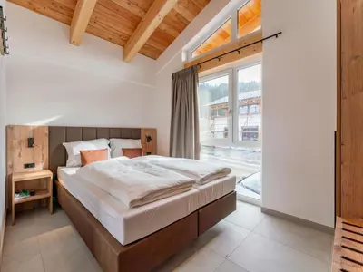 Ein Bett oder Betten in einem Zimmer der Unterkunft Grebenzen Lodges 49B
