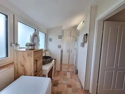 Ein Badezimmer in der Unterkunft Ferienwohnungen Wolfenhaus am See