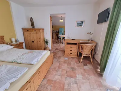 Ein Bett oder Betten in einem Zimmer der Unterkunft Ferienwohnungen Wolfenhaus am See