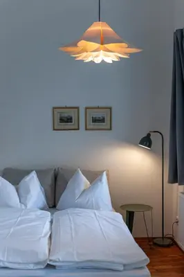 Ein Bett oder Betten in einem Zimmer der Unterkunft Apartment im Lidlhaus, Esplanade - Your Austrian Home