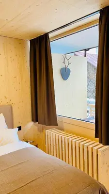 Ein Bett oder Betten in einem Zimmer der Unterkunft Ausseer Hoiznest