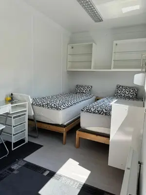 Ein Bett oder Betten in einem Zimmer der Unterkunft Möbilierter Wohncontainer für bis zu 2 Personen in der Gemeinde Rutzenham