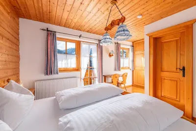 Ein Bett oder Betten in einem Zimmer der Unterkunft Alpenvilla Janerweg - by myNests