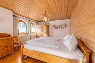 Ein Bett oder Betten in einem Zimmer der Unterkunft Alpenvilla Janerweg - by myNests