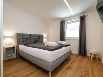 Ein Bett oder Betten in einem Zimmer der Unterkunft Apartment Bergblick Deluxe by Interhome