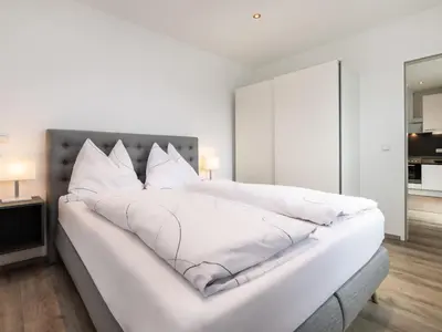 Ein Bett oder Betten in einem Zimmer der Unterkunft Apartment Bergblick by Interhome