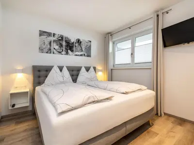 Ein Bett oder Betten in einem Zimmer der Unterkunft Apartment Bergblick by Interhome
