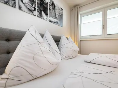 Ein Bett oder Betten in einem Zimmer der Unterkunft Apartment Bergblick by Interhome