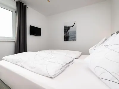 Ein Bett oder Betten in einem Zimmer der Unterkunft Apartment Bergblick by Interhome