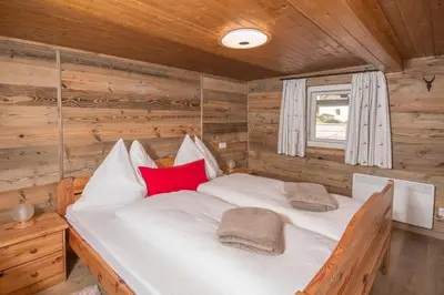 Ein Bett oder Betten in einem Zimmer der Unterkunft Oberbrixen Hütte