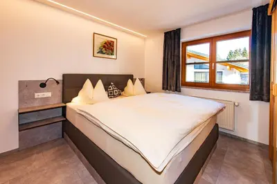 Ein Bett oder Betten in einem Zimmer der Unterkunft Ferienhaus mit 5 separaten Schlafmöglichkeiten