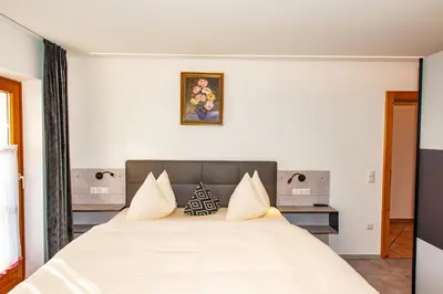 Ein Bett oder Betten in einem Zimmer der Unterkunft Ferienhaus mit 5 separaten Schlafmöglichkeiten