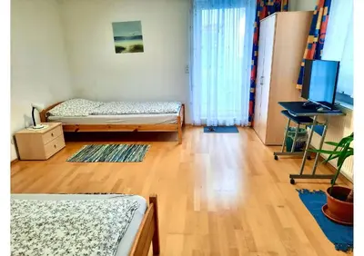 Ein Bett oder Betten in einem Zimmer der Unterkunft Apartments Enser , Gampern
