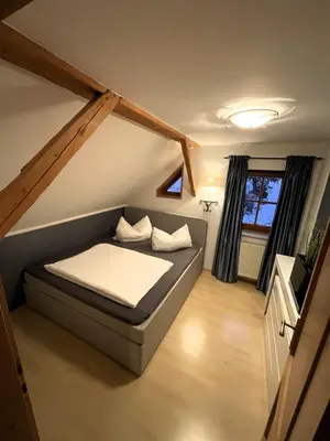 Ein Bett oder Betten in einem Zimmer der Unterkunft Ferienwohnung Aigner