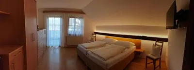 Ein Bett oder Betten in einem Zimmer der Unterkunft Privatzimmer am Weinbrunnen