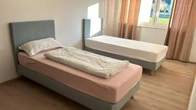 Ein Bett oder Betten in einem Zimmer der Unterkunft Danner Worker Rooms Schörfling - Ruhige Appartements mit Küche für Arbeiter & Firmen