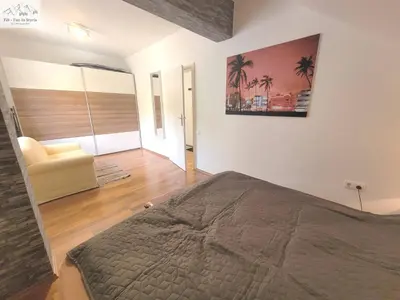 Ein Bett oder Betten in einem Zimmer der Unterkunft Apartment Abendrot by FiS - Fun in Styria