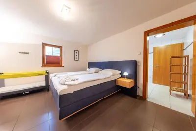 Ein Bett oder Betten in einem Zimmer der Unterkunft Panorama Chalet Lungau