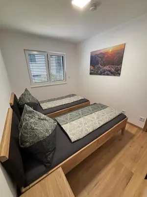 Ein Bett oder Betten in einem Zimmer der Unterkunft Resort Winklfeld 6a