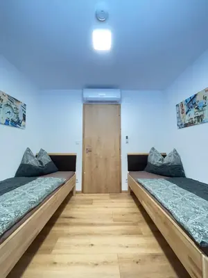 Ein Bett oder Betten in einem Zimmer der Unterkunft Resort Winklfeld 6a