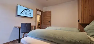 Ein Bett oder Betten in einem Zimmer der Unterkunft Griesbauer Familie Gehwolf