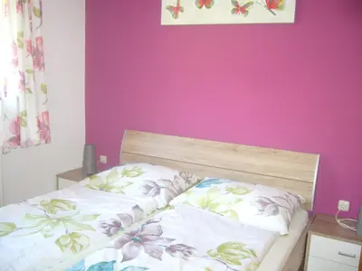 Ein Bett oder Betten in einem Zimmer der Unterkunft Ferienhof Fischenhaus