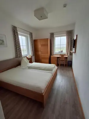 Ein Bett oder Betten in einem Zimmer der Unterkunft Gästehaus Watschinger