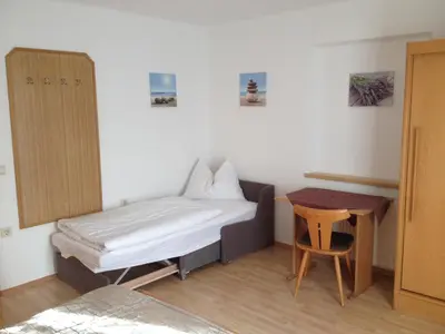 Ein Bett oder Betten in einem Zimmer der Unterkunft Gästehaus Schwed