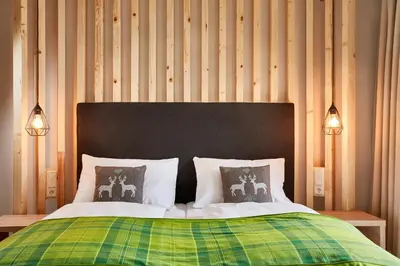 Ein Bett oder Betten in einem Zimmer der Unterkunft Das Alpenhaus Katschberg 1640 inkl Lungau Card