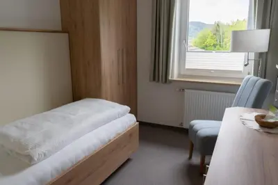 Ein Bett oder Betten in einem Zimmer der Unterkunft Pension Strobl